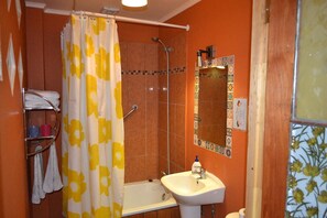 Shower, slippers, towels, soap