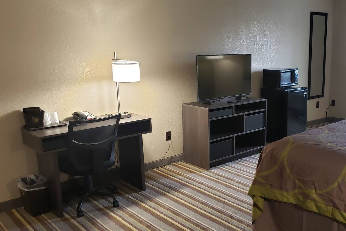 Desk, laptop workspace, blackout drapes, soundproofing