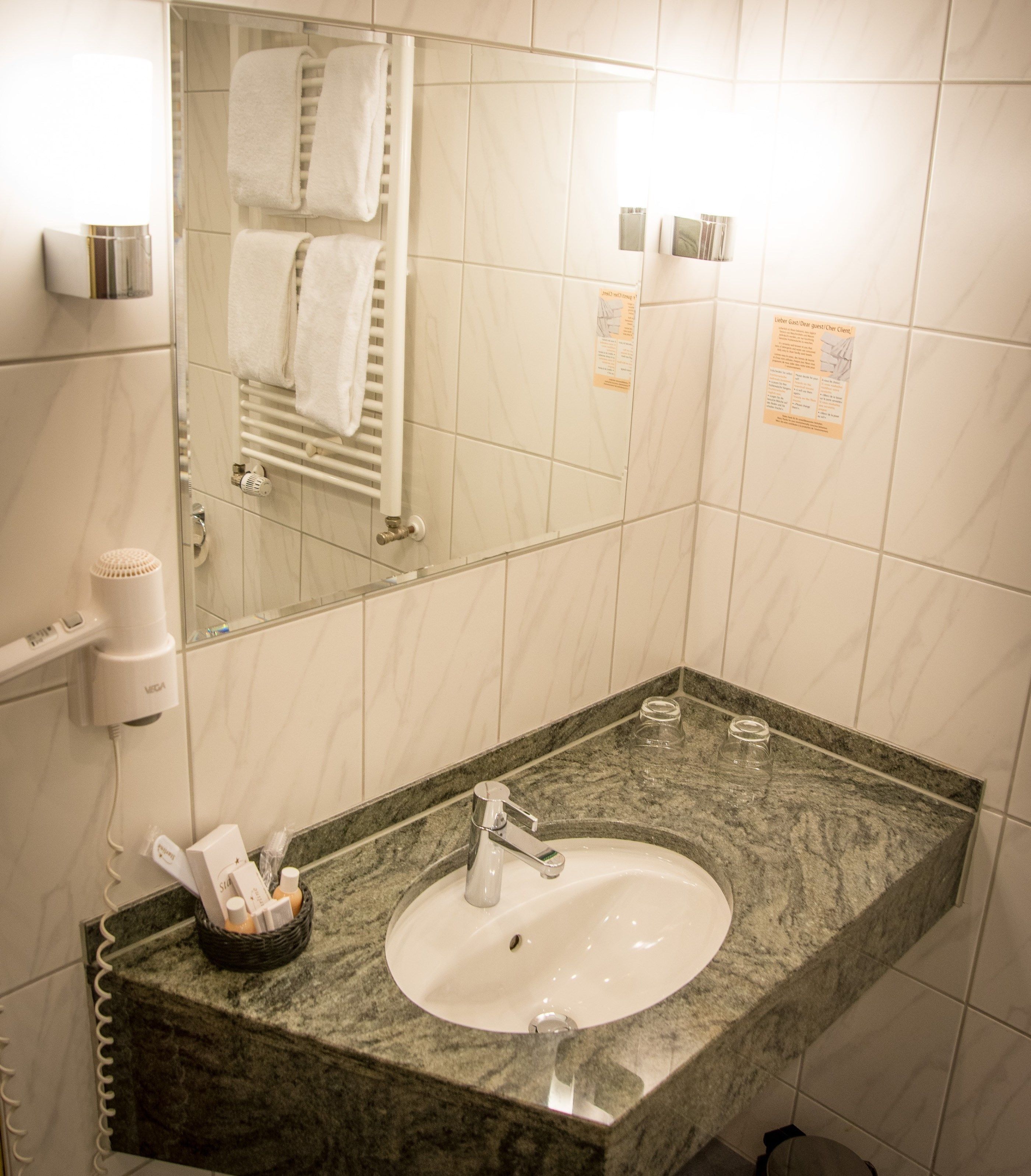 hair dryer, towels, soap, shampoo