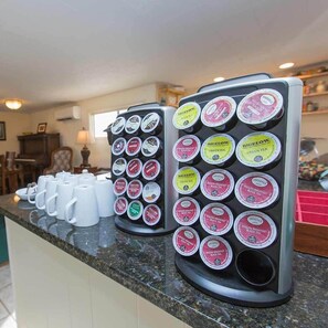 A coffee station with multiple dispensers of tea and coffee, arranged on a counter. - Brookside Bed & Breakfast (Hood River)
