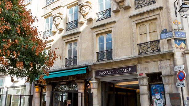 A building with a cafe named "Passage du Caire" on the ground floor. - Classic Style by Rue Montorgueil, by Veeve (Paris)