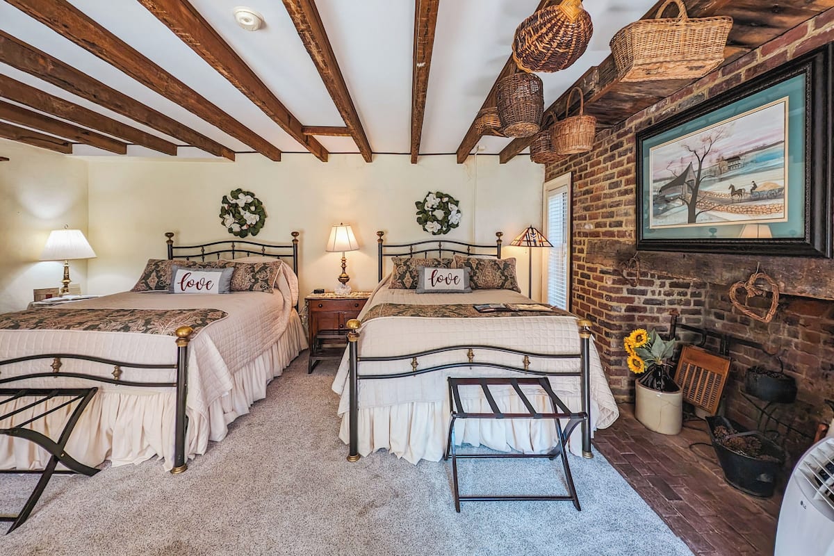 Room, 2 Queen Beds, Courtyard Area | Individually decorated, individually furnished, iron/ironing board