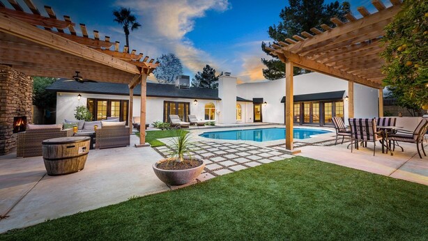 A backyard with a pool, outdoor seating, and a pergola. - Kierland Retreat w/Heated Pool & Outdoor Fireplace  (Scottsdale)