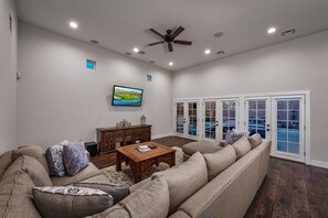 Smart TV, fireplace, books, video library