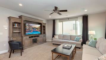 TV, lareira, mesa de pingue-pongue, livros