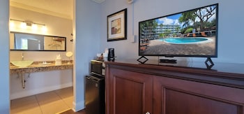 In-room safe, desk, laptop workspace, blackout drapes at Fort Lauderdale Grand Hotel