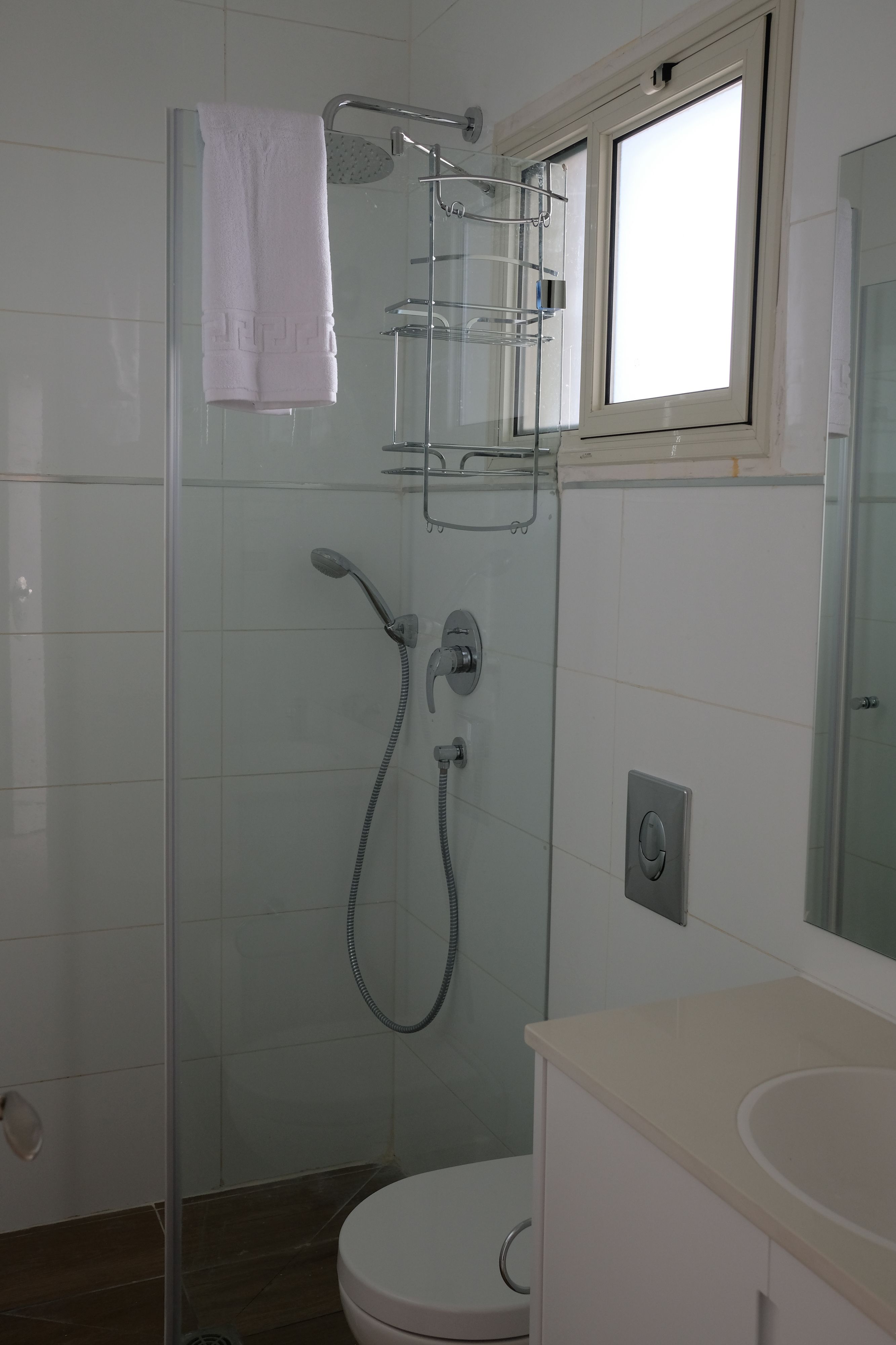 shower, designer toiletries, hair dryer, towels