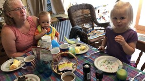 A dining table with various food items, drinks, and utensils. - Mulberry Bed & Breakfast (Wareham)