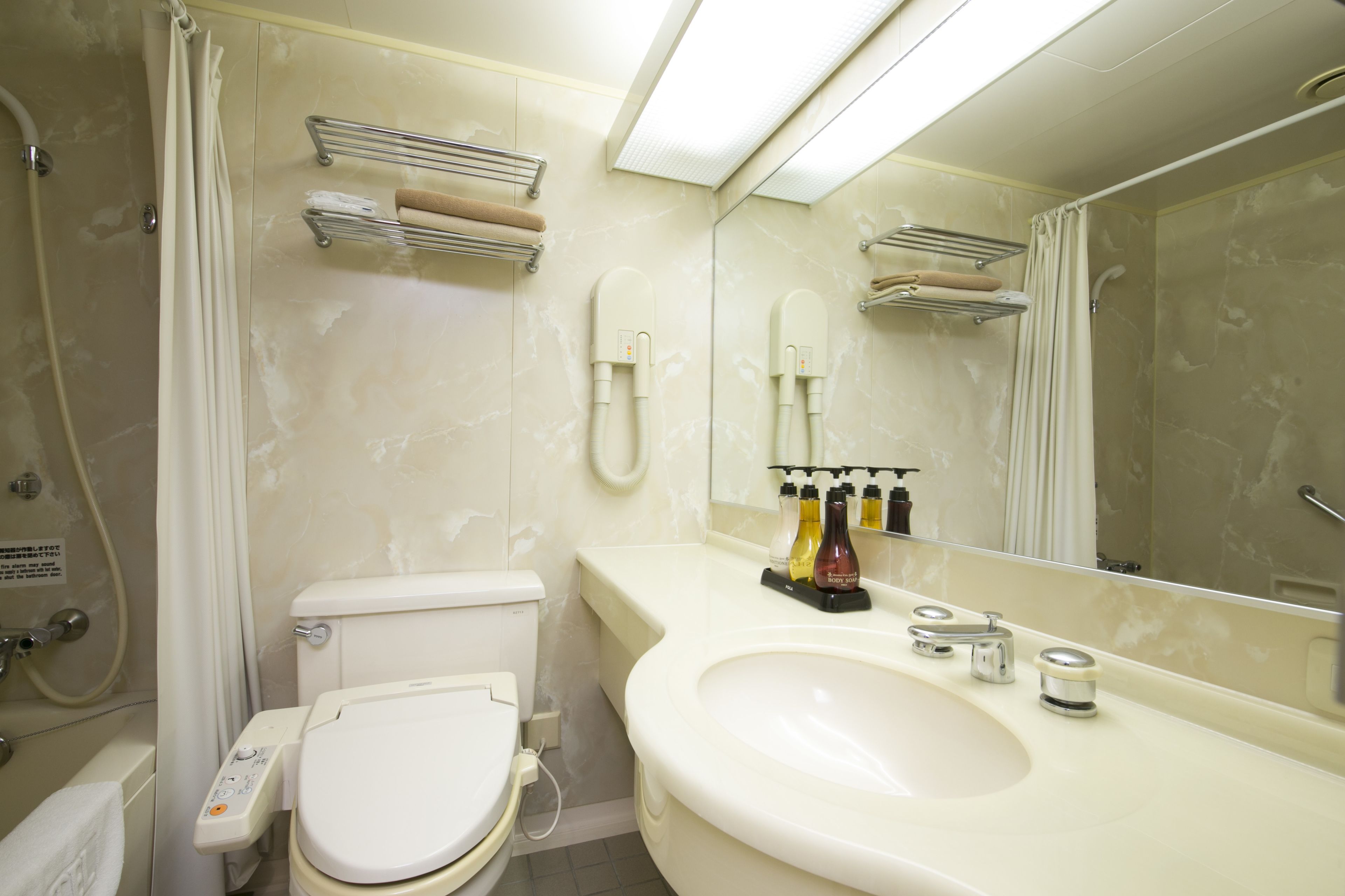 combined shower/bathtub, free toiletries, hair dryer, slippers