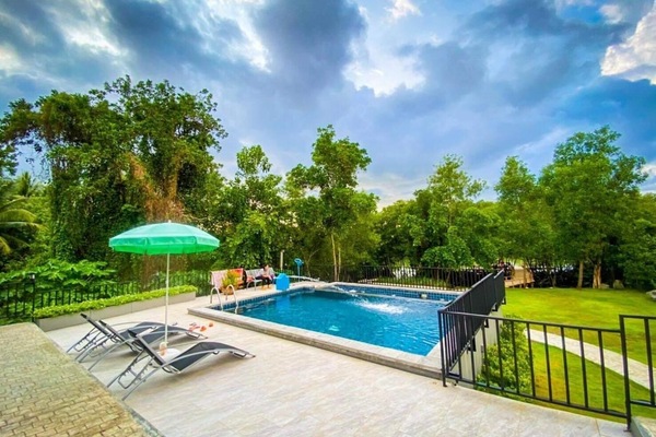 Outdoor pool, open 7 AM to 10 PM, pool umbrellas, sun loungers