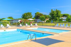 Seasonal outdoor pool, pool loungers