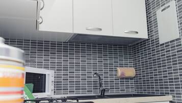 Luxury Studio Suite, Kitchenette | Private kitchen | Fridge, microwave, oven, stovetop