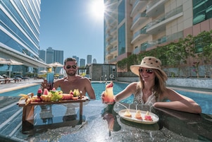 2 outdoor pools, open 6 AM to 10 PM, pool umbrellas, pool loungers