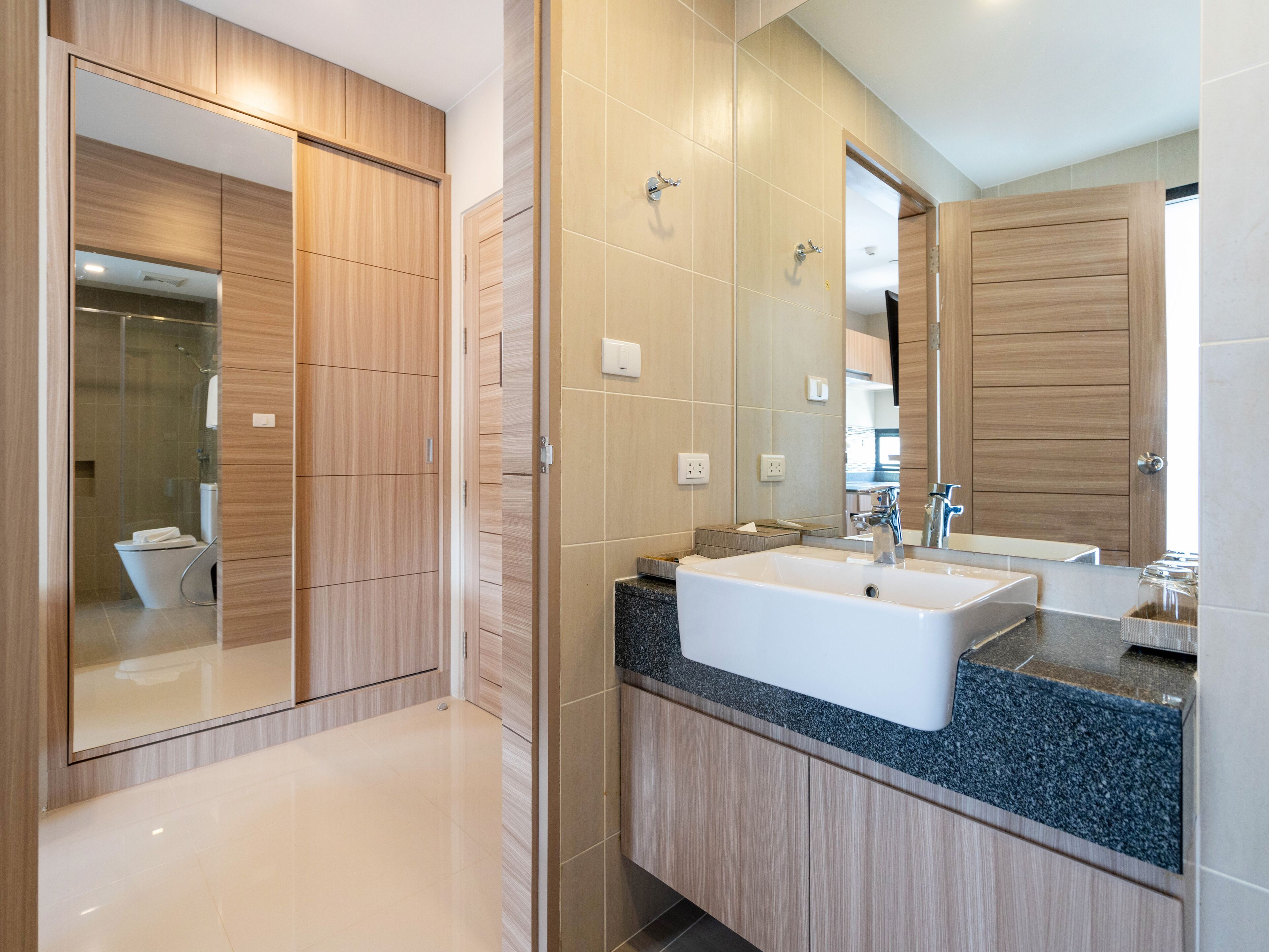 grand deluxe room | bathroom | shower, free toiletries, hair dryer, bathrobes