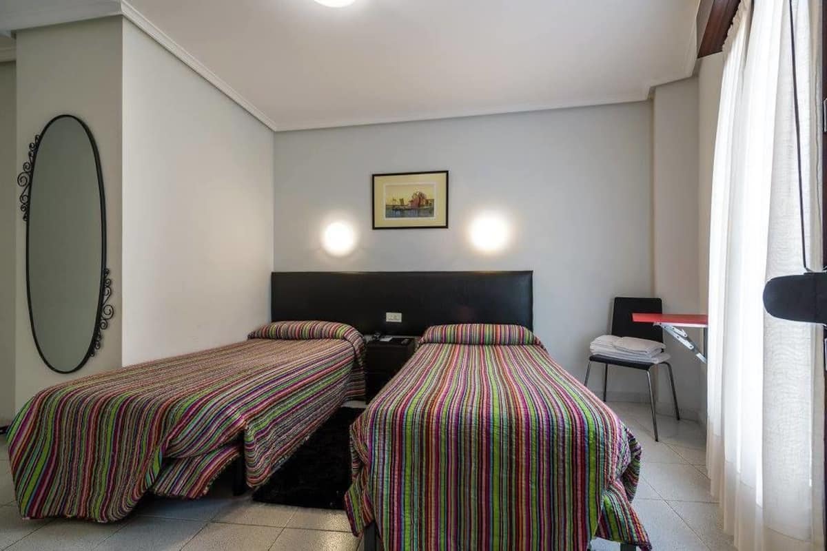 Twin Room, Balcony, City View | Desk, WiFi (free), bed sheets