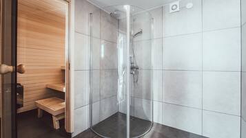 Shower, hydromassage showerhead, hair dryer, towels