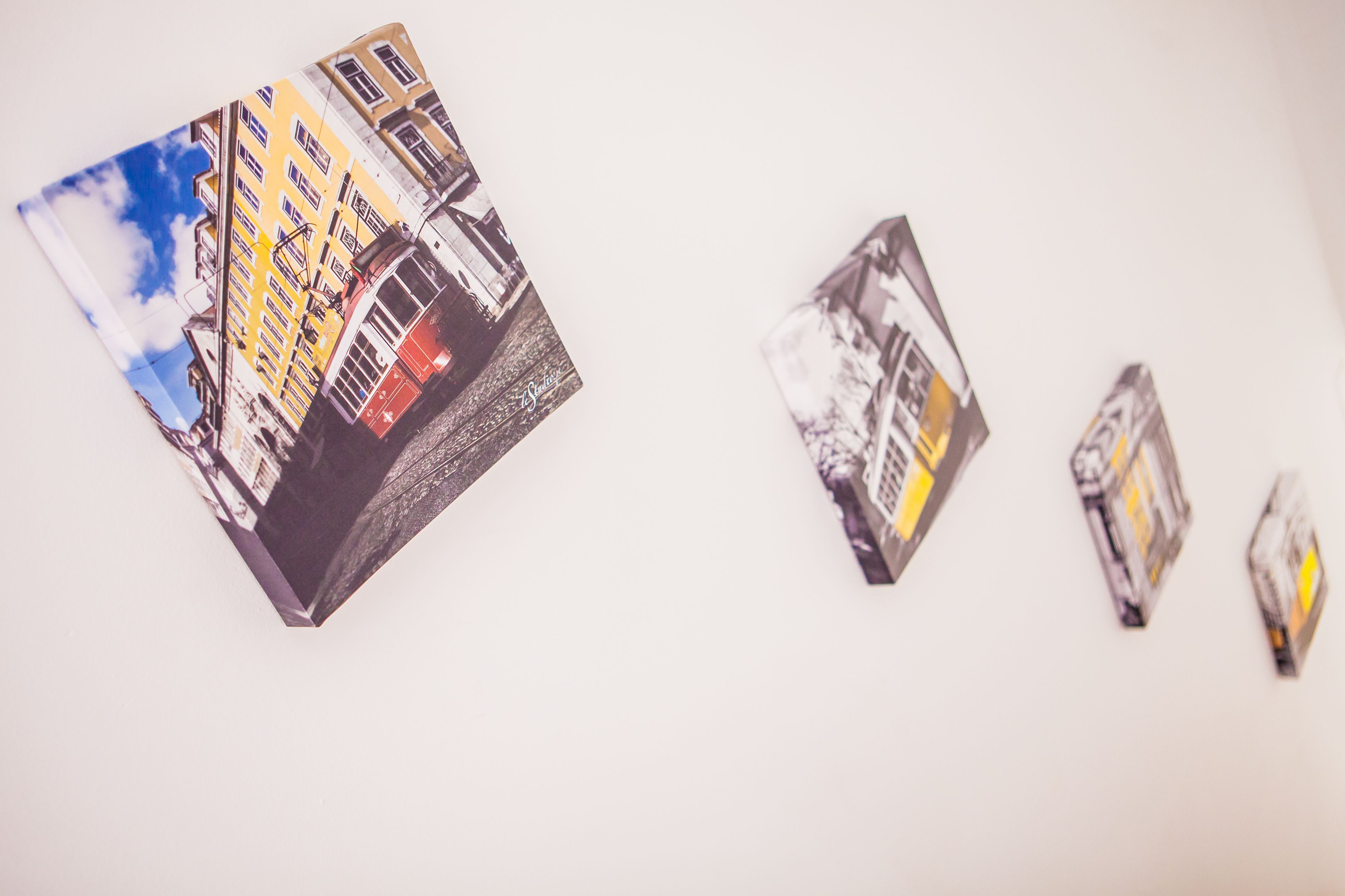 A series of postcards with a building and a tram.