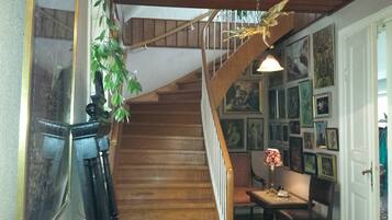 A staircase with wooden steps leading to a landing.