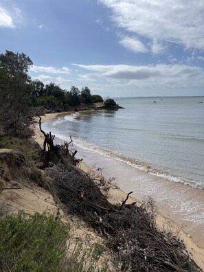 On the beach, sun-loungers
