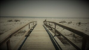 A wooden boardwalk leading to the beach. - 4 Bed/2 bath- sleeps 9, club cards avail, Golf cart, pets ok, neighborhood pool (St Helena Island)