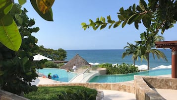 A heated pool, sun loungers