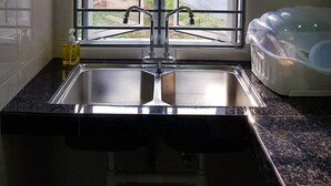 Apartment, 4 Bedrooms | Private kitchenette | Coffee/tea maker, full-size fridge, microwave, stovetop