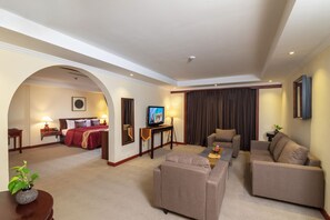 Honeymoon Suite, Bathtub, Balcony | Living area | 64-inch LCD TV with cable channels, TV, fireplace - Hotel de la Renaissance (Siem Reap)