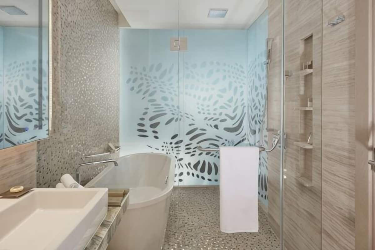 Separate bathtub and shower, free toiletries, hair dryer, slippers