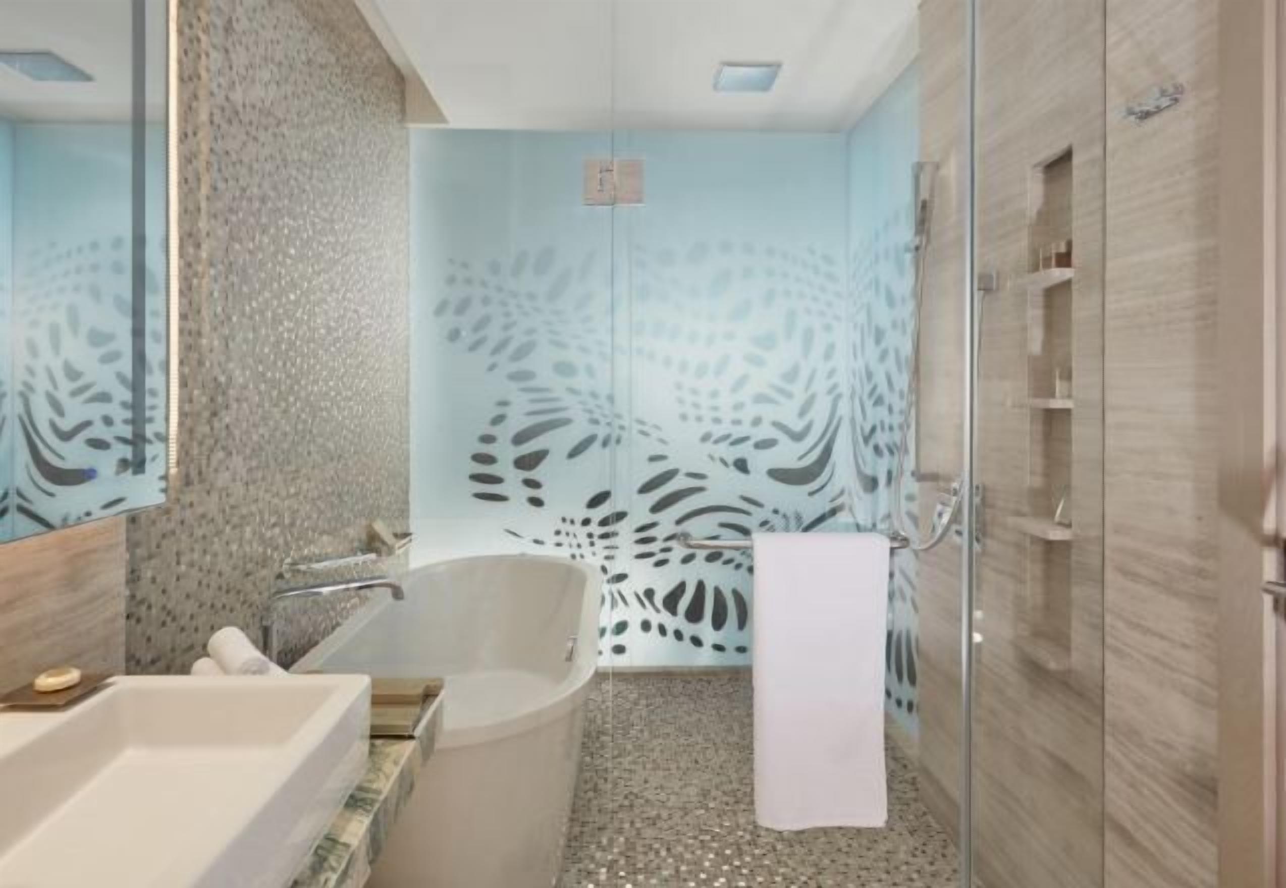 Separate bathtub and shower, free toiletries, hair dryer, slippers