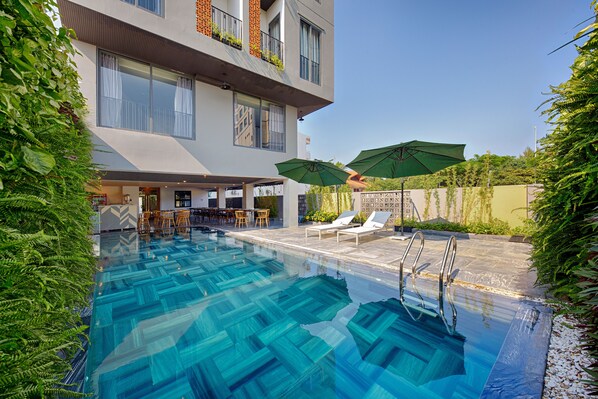 Outdoor pool, open 6:00 AM to 7:00 PM, sun loungers