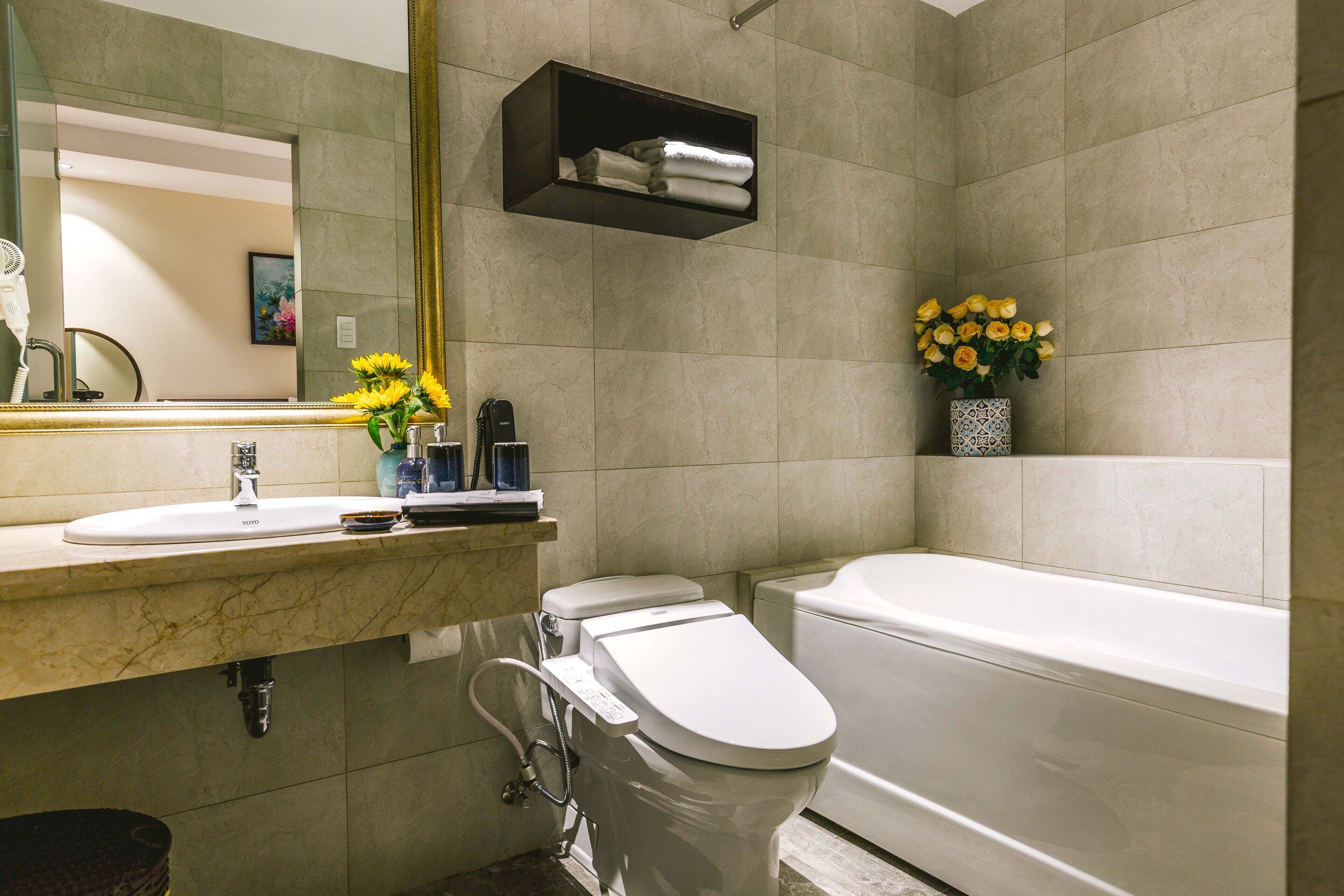 bathtub, free toiletries, hair dryer, slippers