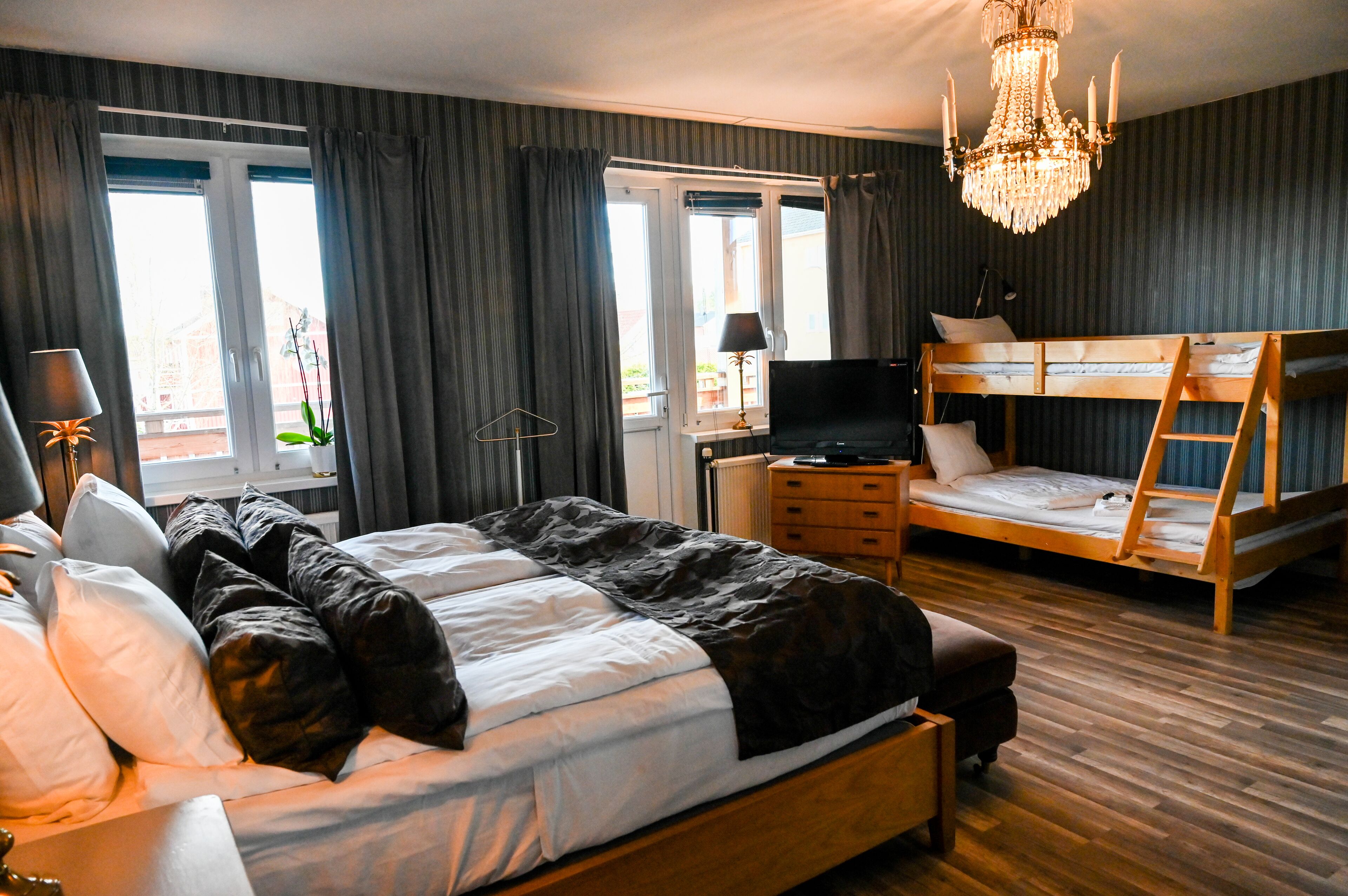 family room, multiple beds, balcony, courtyard area | premium bedding, minibar, individually decorated, individually furnished