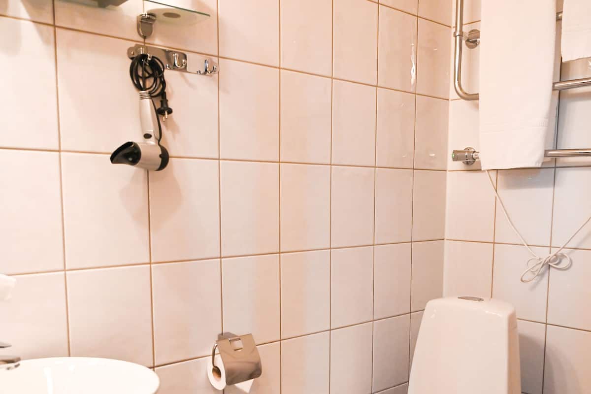 standard single room | bathroom | separate bathtub and shower, deep-soaking bathtub, rainfall showerhead