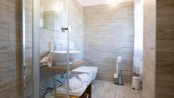 Shower, rainfall showerhead, bidet, towels