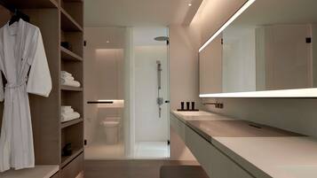 A modern bathroom with a walk-in shower, a large mirror, and a robe rack.