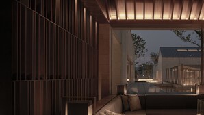 A modern interior with a seating area, a wooden slatted wall, and a view of the outside. - Alila Wuzhen, Zhejiang (Jiaxing)
