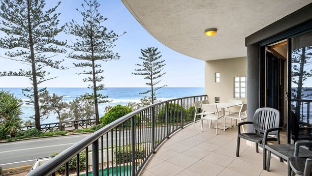 A balcony with a view of the ocean, outdoor seating, and a railing. - Unit 4 'The Rocks', Coolum Beach (Coolum Beach)