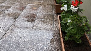 A courtyard with potted plants and a sign reading "ERSOY AK PANSIYON". - Ersoy Ak Pansiyon (Antalya)