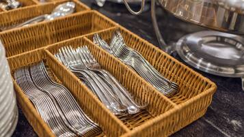 Wicker baskets containing silverware.
