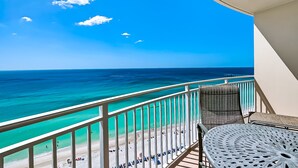 A balcony with a view of a beach and ocean. - Aqua Beach Resort by Aneliya's Rentals (Panama City Beach)