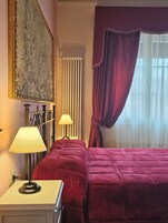 Comfort Room | Down comforters, desk, blackout drapes, iron/ironing board