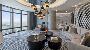 A modern hotel room with a circular ceiling light, large windows, and a patterned floor. - Fairmont Riyadh (Riyadh)