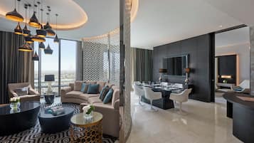 Suite, 2 Bedrooms | Living area | 6-inch flat-screen TV with cable channels, TV