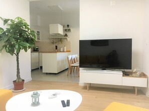 Apartment, Garden View | Living area | Flat-screen TV, fireplace