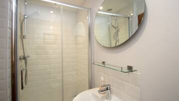 Combined shower/tub, hair dryer, towels, soap