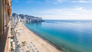 A coastal cityscape with a beach, high-rise buildings, and a clear blue sky. - Principado Arena 18-A Levante Beach (Benidorm)
