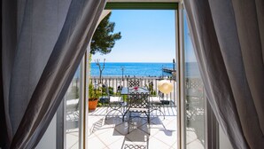 A balcony with a view of the sea, outdoor furniture, and a railing. - Vicaria, Sea View, a few steps from beach by AMALFIVACATION.IT (Minori)