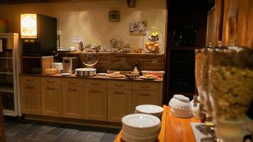 A kitchen with wooden cabinets, a coffee machine, and various kitchenware.