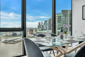Executive 3 bed, 2 bath apartment with city and harbour views | Living area | 55-inch Smart TV with satellite channels, Netflix, streaming services - Melbourne Lifestyle Apartments - Best Views on Collins (Docklands)