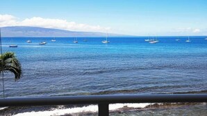 A coastal view with multiple sailboats on calm waters, a clear sky, and a distant mountain range. - Perfect location and Unbelievable Views at Lahaina Roads (Lahaina)
